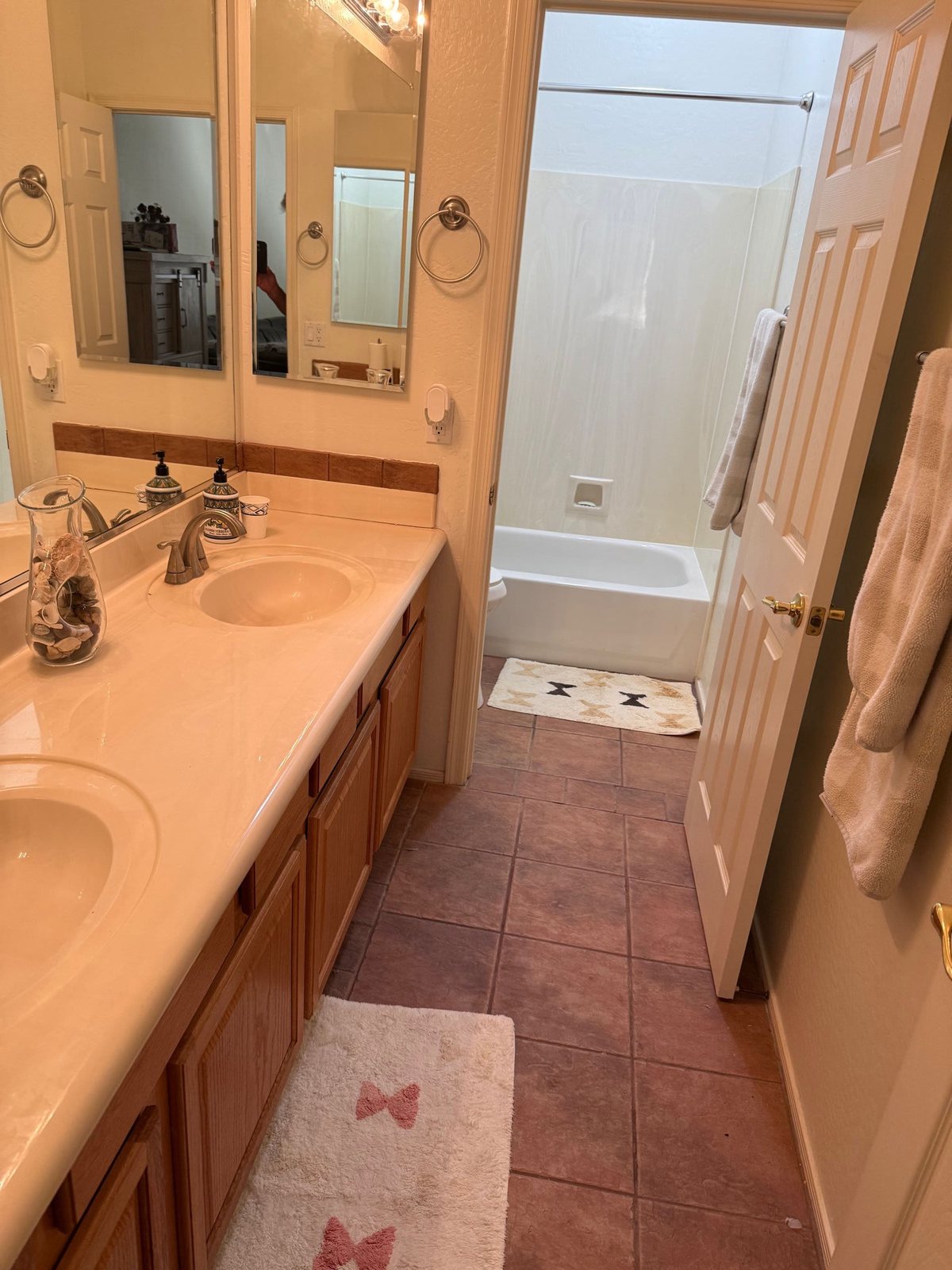 Before — dated pink tile bathroom ready for remodel