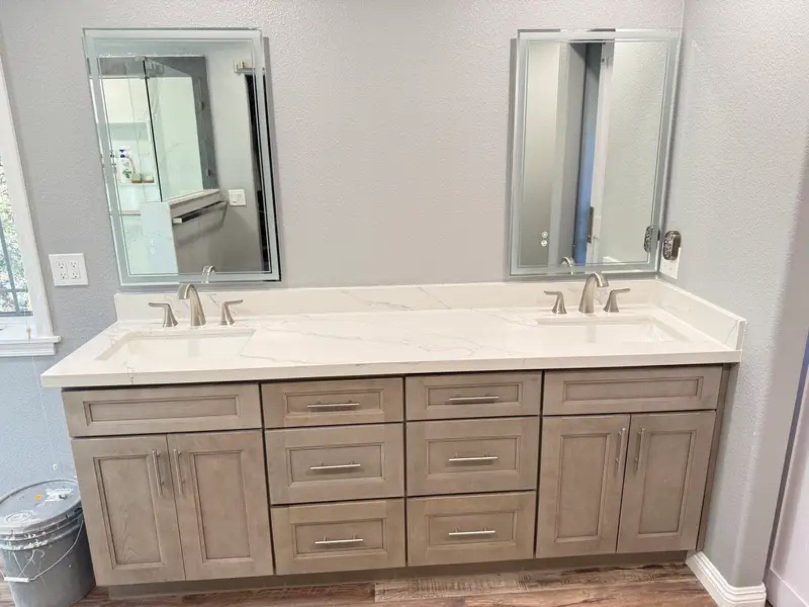 Double vanity with gray shaker cabinets and quartz countertop