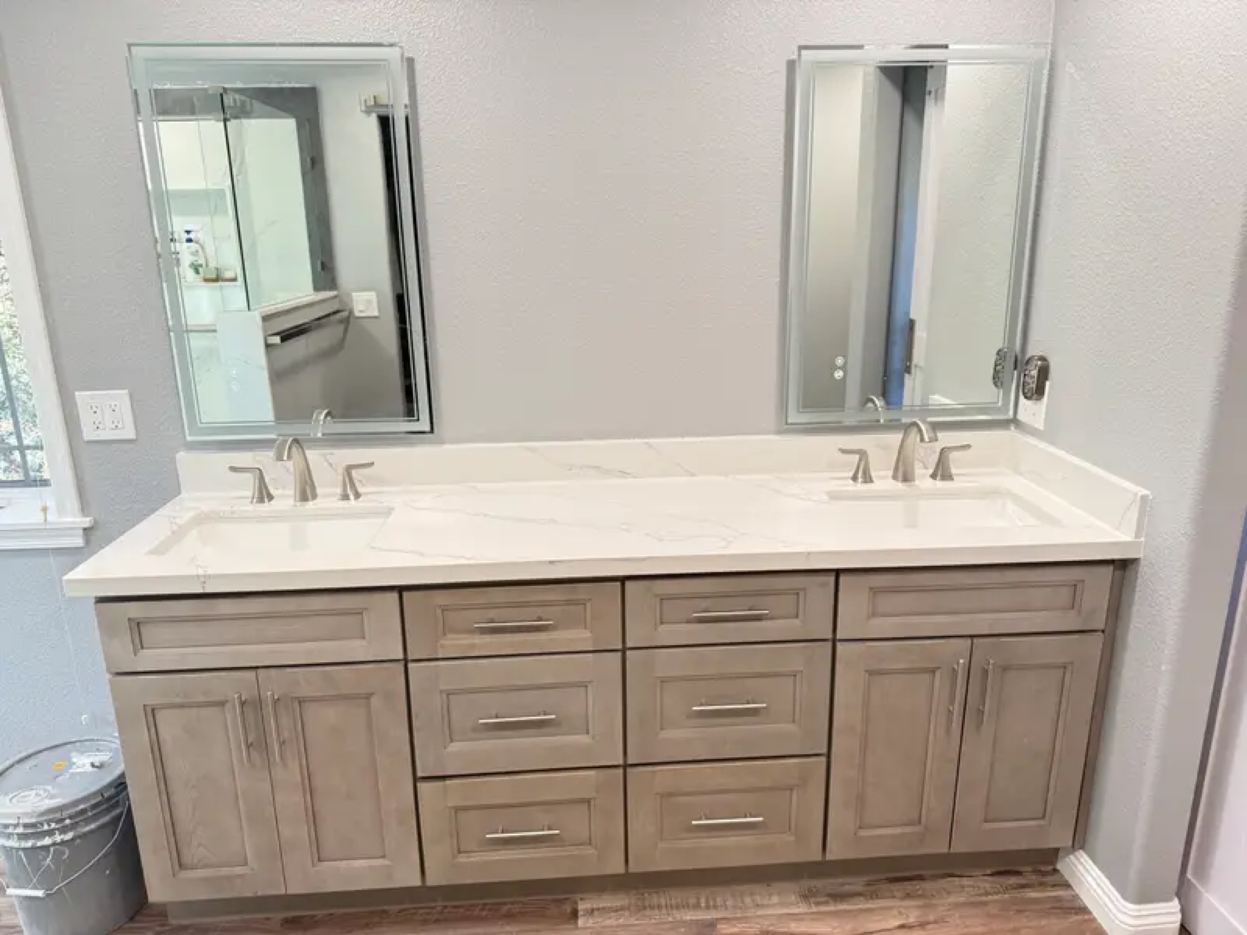 Double vanity with gray shaker cabinets and quartz countertop